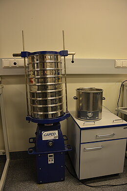 Large sieves (300 mm) and sieving device.